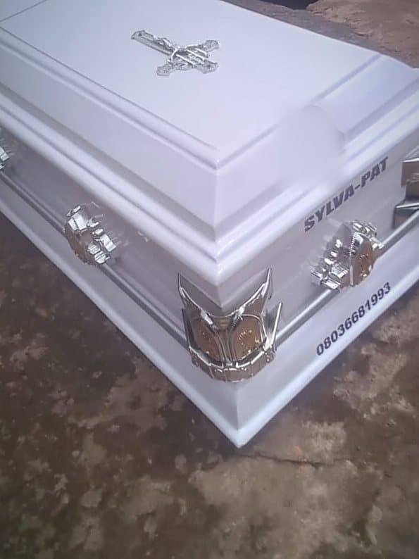 Chrome short handles and a chased corner mount on a white Supreme casket